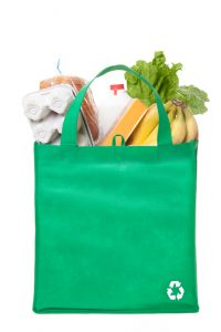 A reusable grocery bag with recycle symbol
